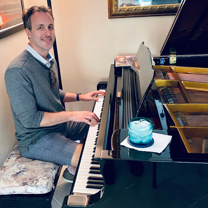 Hidden Talents - Jeff at a Piano With Hands on Keys