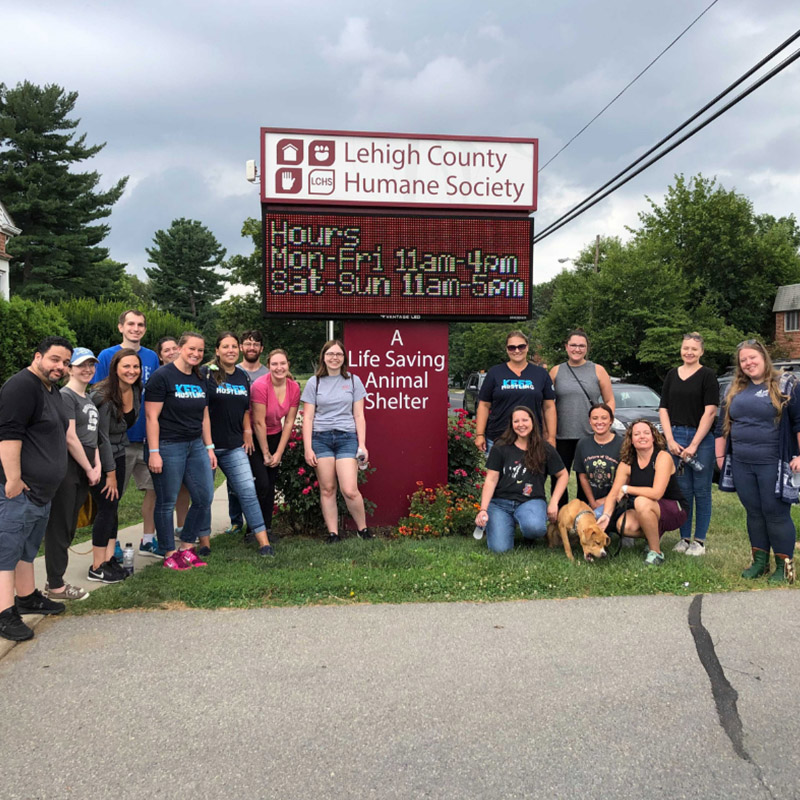 Lehigh County Humane Society - Team Standing Around Sign