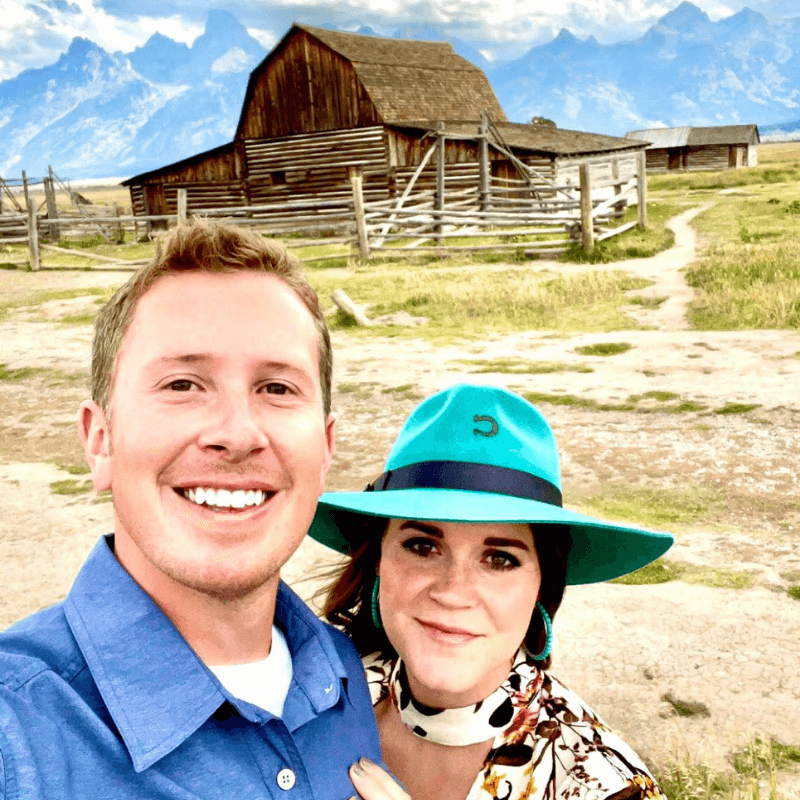 Best of 2021 - Alexis and Her Husband in Front of a Wooden Farm Building