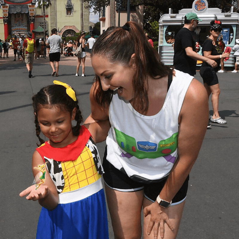 Best of 2021 - Melissa and Her Daughter Pretending to Hold Tinkerbell